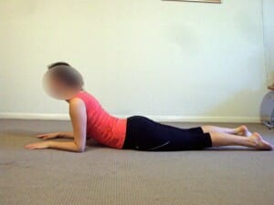 Prone extensions in lying McKenzie exercise for disc low back pain