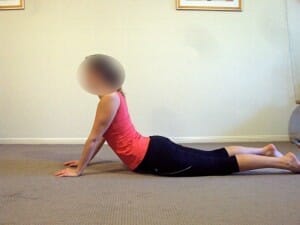 Prone extensions in lying McKenzie exercise for disc low back pain physiotherapy
